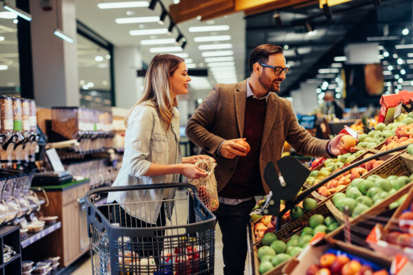 Couple buying fruits in grocery store